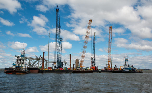 Salvors assemble cranes to aid salvage efforts on April 6, 2024, following the Francis Scott Key Bridge collapse