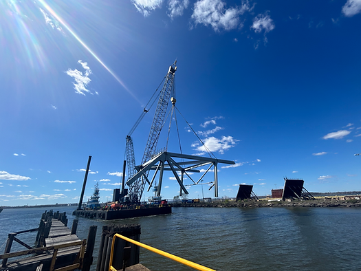 Salvage crews operating with the Key Bridge Response 2024 Unified Command move a section of Francis Scott Key Bridge to Sparrows Point in Baltimore, April 7, 2024
