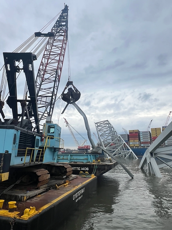 Contracted salvors continue to remove bridge wreckage from the Patapsco River in efforts to reopen the shipping channel in Baltimore, April 10, 2024
